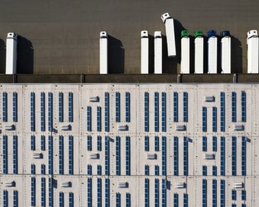 Aerial_View_of_Cargo_Containers_and_Distribution_Warehouse_with_Renewable_Energy_Plants (1)