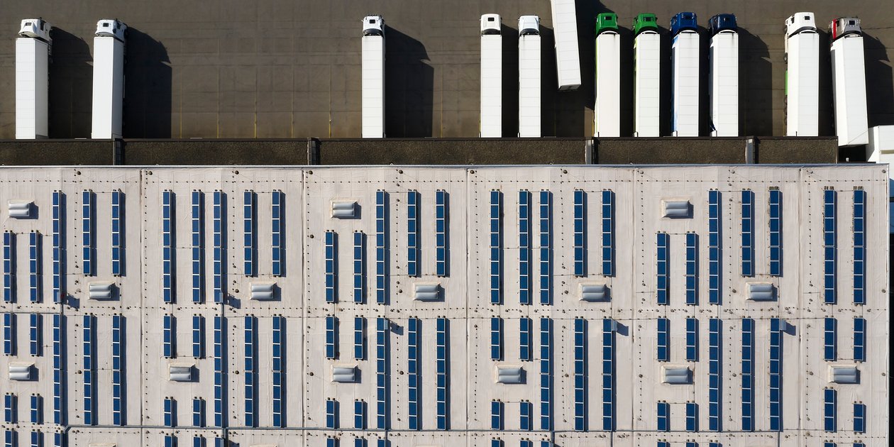Aerial_View_of_Cargo_Containers_and_Distribution_Warehouse_with_Renewable_Energy_Plants