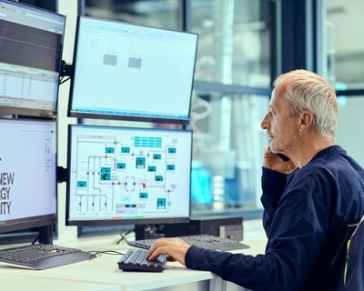 Man talking in phone in control room