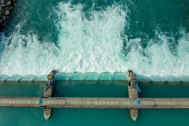 Water-cascading-over-a-dam,-symbolizing-a-controlled-and-abundant-water-source_675x450